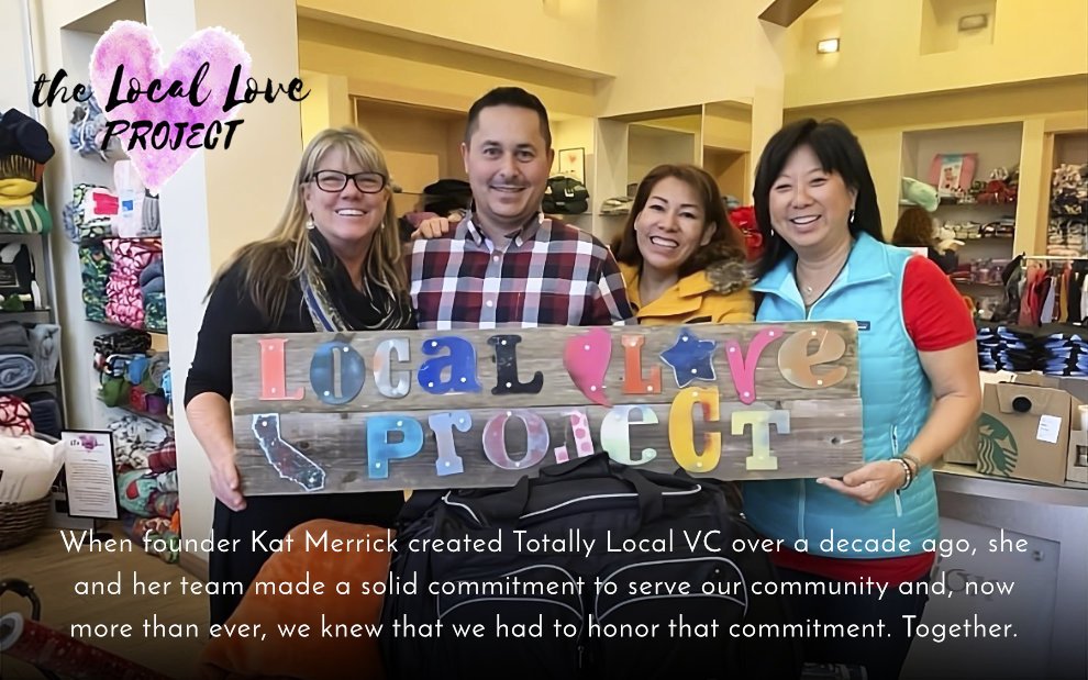 People holding Local Love Project sign